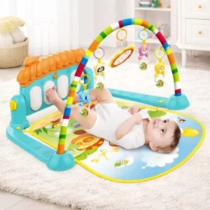 A happy infant kicking the keys on the ToysBuddy Piano Baby Gym Mat.