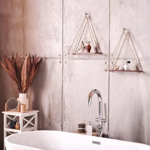 A beautiful set of Adjustable Rope Hanging Shelves displayed on a brightly lit living room wall.