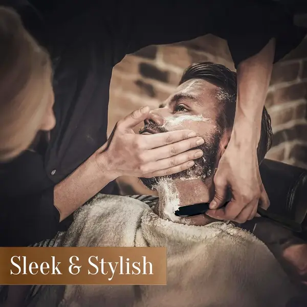 A professional master barber using the Japanese Straight Edge Razor to shape a clean beard line on a client.