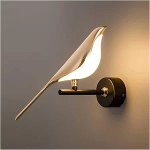 The elegant Modern LED Bird Light glowing warmly on a dark living room wall.