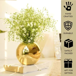 Gold metal flower vase with a mirrored finish