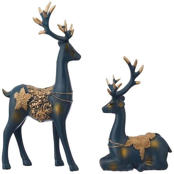 The resin figurine placed perfectly next to a beautifully wrapped gift box.