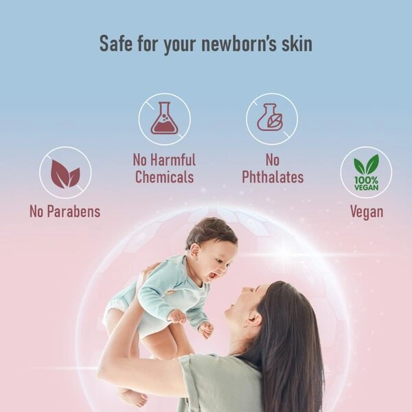 A smiling baby enjoys a bath with the Sebamed Baby Cleansing Bar lather.