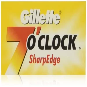 A front product photograph of the 100-count 7 O'clock Safety Razor Blades Pack display card.