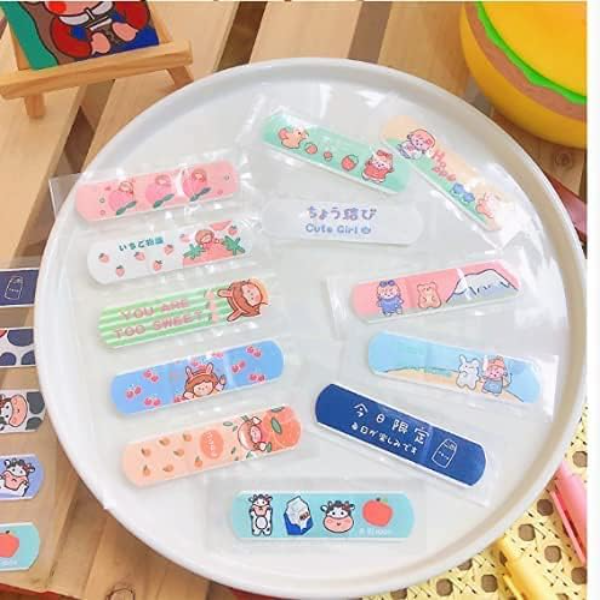 A 300-count collection of 9UP cute cartoon printed bandage boxes displaying colorful, water-resistant strips for USA kids' safety.