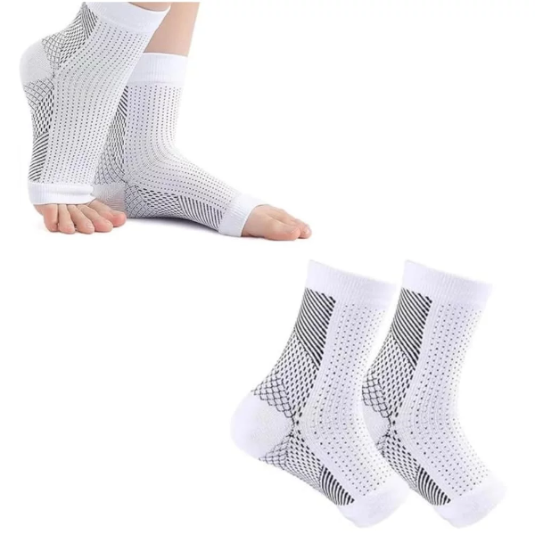 A pair of premium white toeless neuropathy compression socks providing snug ankle support on a model's feet.