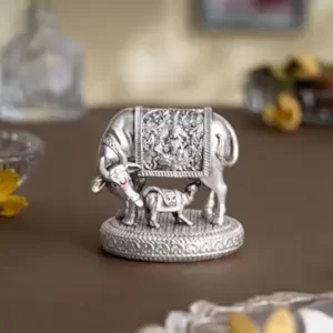 Svastika Silver-Plated Kamdhenu Cow with Calf Idol – Vastu Feng Shui Symbol for Wealth, Prosperity & Positive Energy | Auspicious Home Décor Gift for Weddings & Housewarming (2.5 Inch)