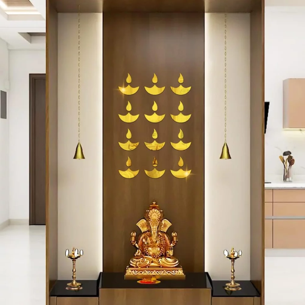 Ten golden diya mirror wall stickers arranged elegantly on a clean living room wall.