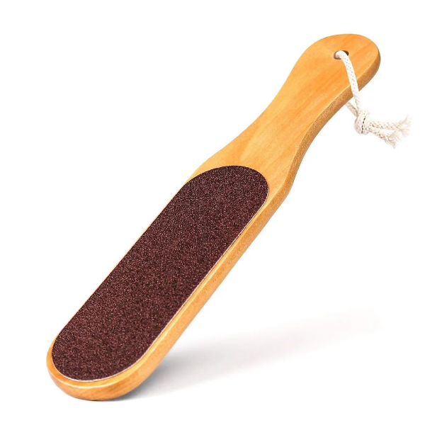 A 4-in-1 foot pedicure brush and callus remover paddle with a hanging loop.