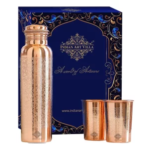 A professional product photograph of the 3-piece Pure Copper Bottle Set arranged beautifully outside its blue gift box.