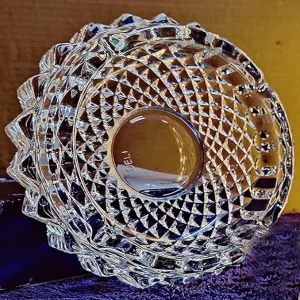 A transparent Crystal Tortoise Vastu Showpiece resting nicely on a modern desk.
