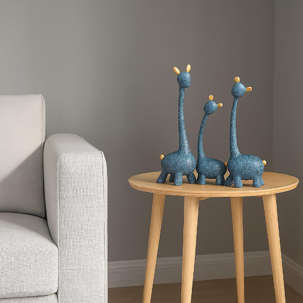 A macro close-up showing the speckled teal finish and gold accents on the Blue Giraffe Family Statue.