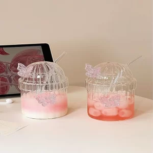 Aesthetic pink 3D butterfly glass tumbler with dome lid and straw.