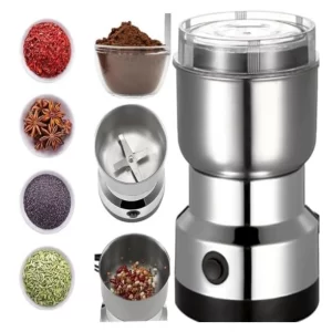 The sleek metallic Mini Electric Spice Grinder resting on a modern kitchen countertop next to fresh coffee beans.